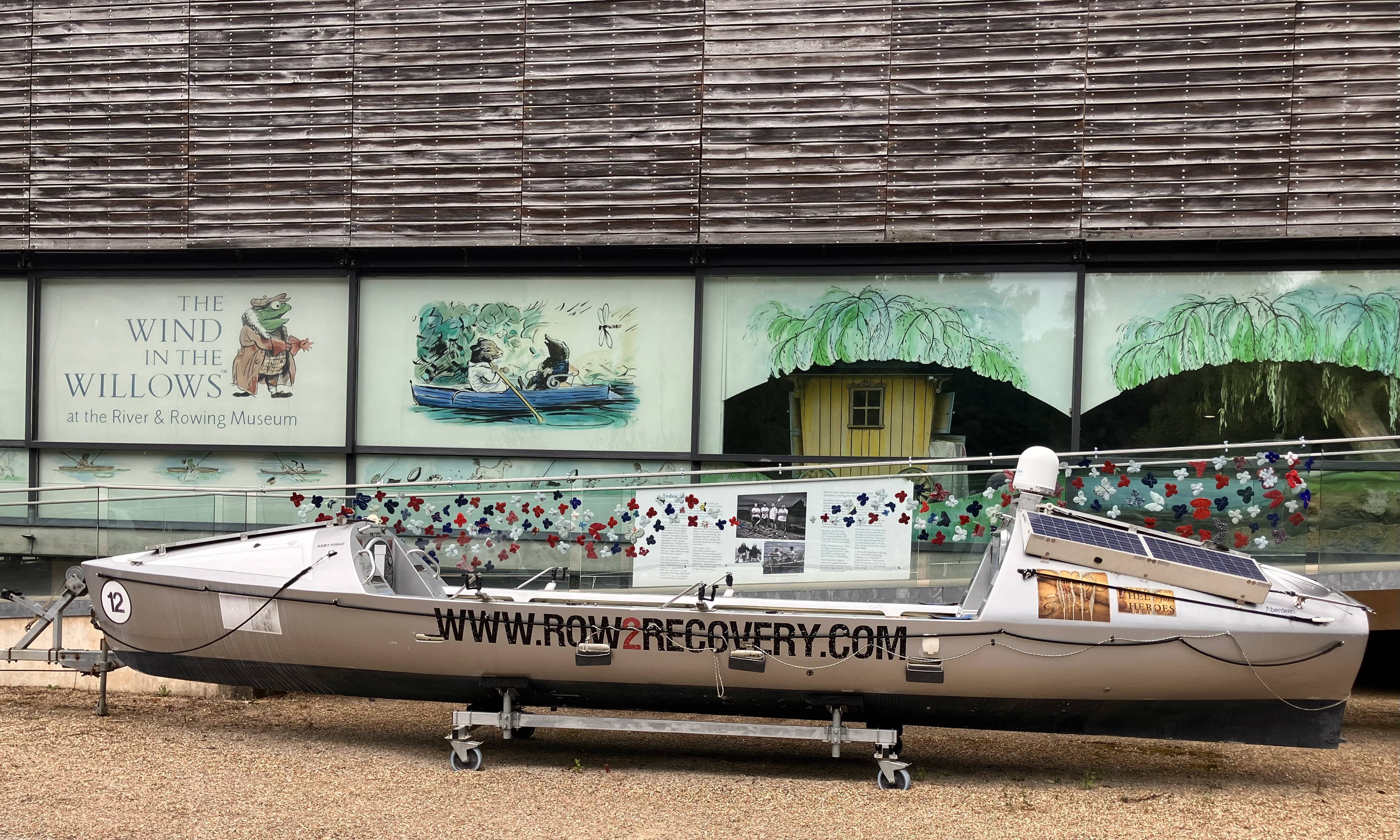 knitted butterflies behind a rowing boat