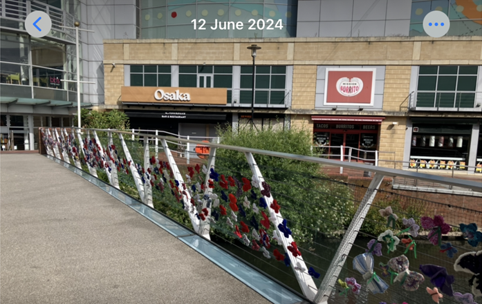 knitted butterflies on a pedestrian bridge